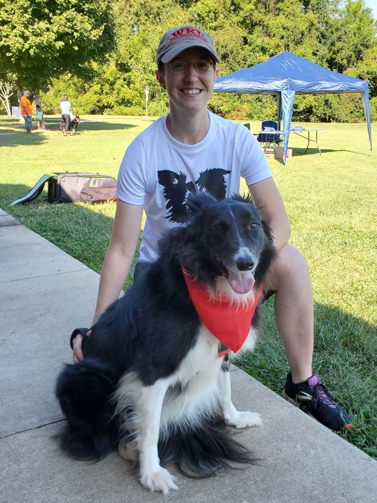 Finley the dog and Jordan the pet sitter at Bowling Green Bark For Life